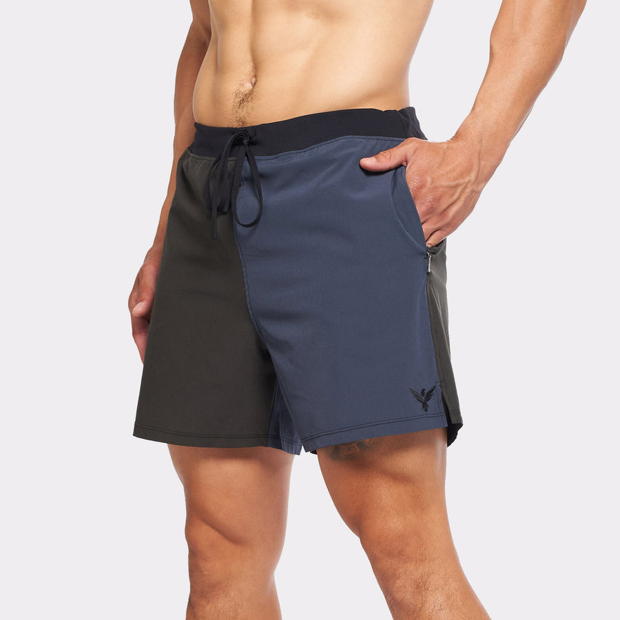 Flow shorts in blue and black, designed for hot yoga with moisture-wicking fabric and quick-dry lining.