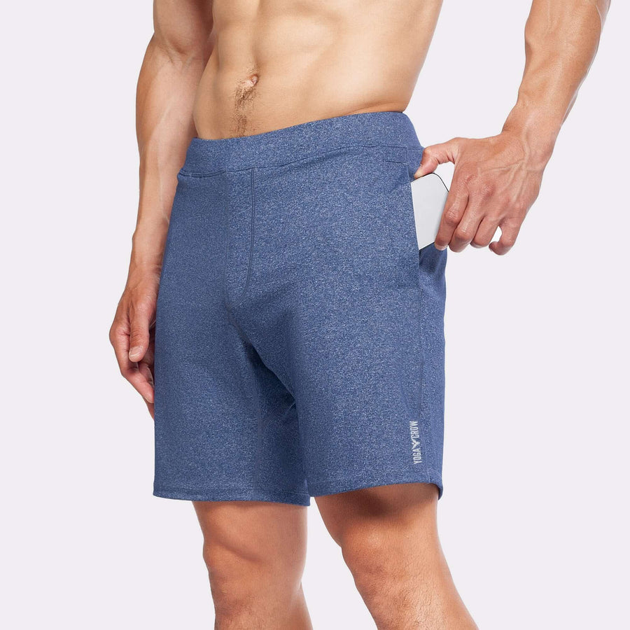 4-Way stretch swerve shorts in heather navy with hand in pocket for easy storage during workouts.